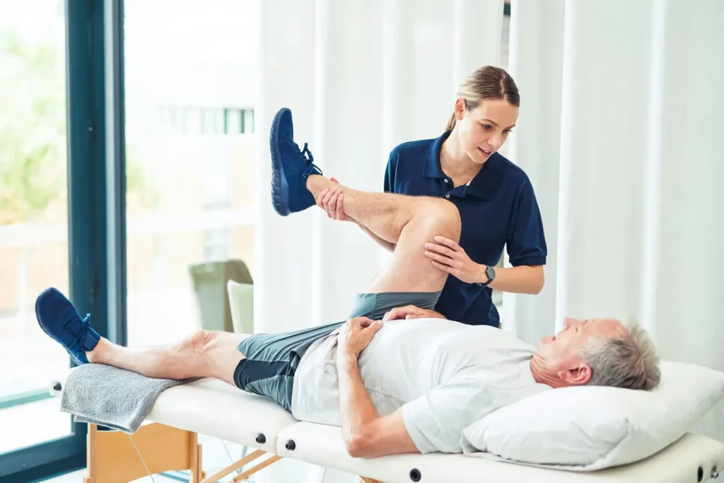 Revitalising Recovery: Effective Rehabilitation Strategies for Muscle Injuries 3 Physiotherapist assisting a patient with muscle recovery exercises Amersham