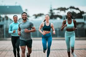 Sculpting Sleek Arms: The Essential Role of Cardio in Toning Without Bulking Up 3 image of people running to incorporate cardio Amersham exercise into their life to help tone arms and body.